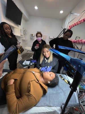 Our lead Instructor (owner) demonstrating lip fillers to students interested into learning more about the technique.