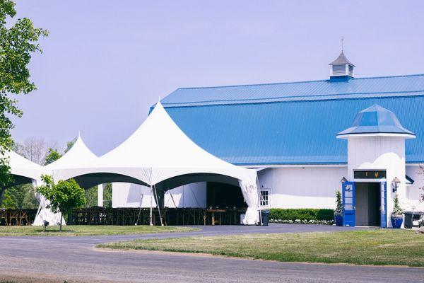 Our Reception Barn and High-Top Dining Tent. Both comfortably accommodate 200 guests. Courtesy of First Glance Photography.