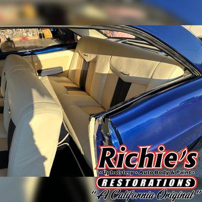 Custom handcrafted leather seats with tri-color combo for the entire interior, per customer request -- Off white, Cream, and Navy blue.