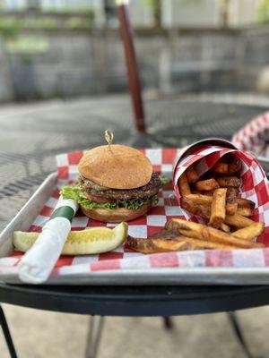 Burger with grilled onions and fries