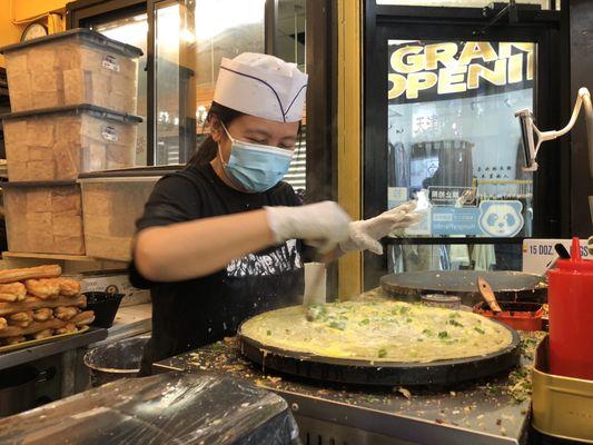 deep-fried dough sticks rolled in a thin pancake is a popular Chinese street food originating in Tianjin