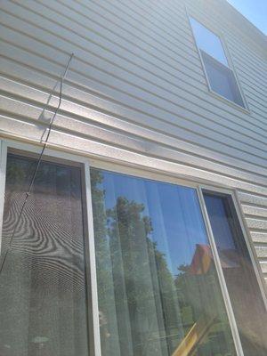 Nailed a finishing nail into face of siding creating huge dent.