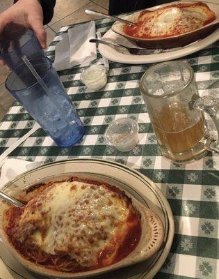 Manicotti trio; baked spaghetti. (Not shown: side salads.)