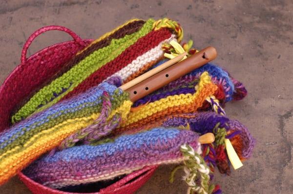 Children learn to play several musical instruments throughout their 8 years. Here, they have knitted their own recorder bags.