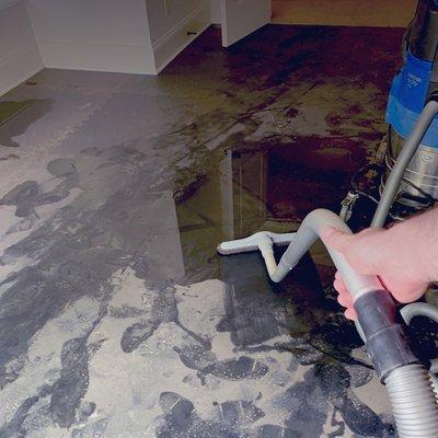 Vacuuming Up Water from a Flooded Basement