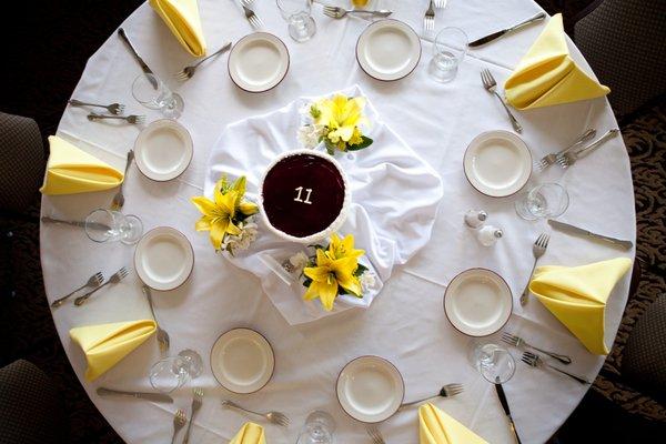 Flowers and cake combined for a unique center piece!