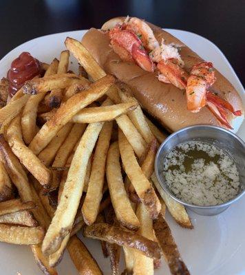 Lobster roll with hot fries.