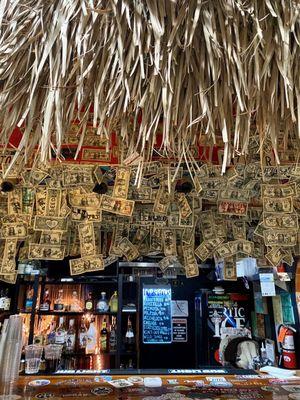 The bar with the dollar bills ~