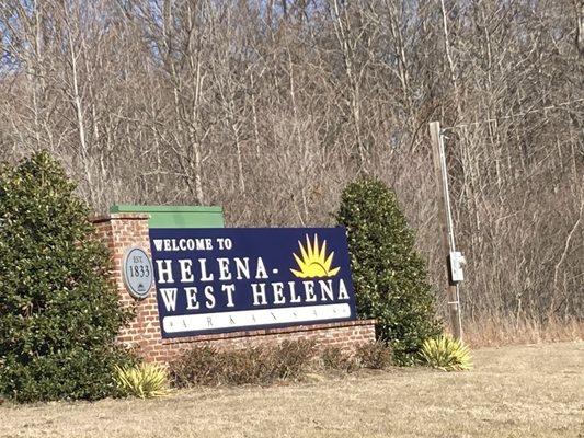 sign located right next to entrance of Arkansas Welcome Center, located within Helena - West Helena, Arkansas