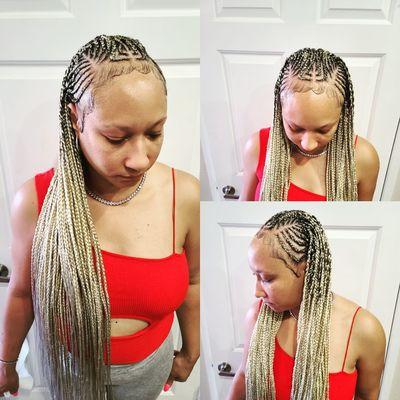 Feel in cornrows with individuals in the back done by africarine and