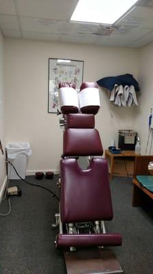 Table in room 1. This table allows patients who are unable to get on to the table due to back pain the ability to do so with less pain.