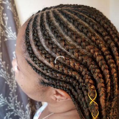 Tribal braids cornrows. 
One of the trending hair styles up till date.