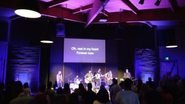 The band leading us in a sing along worship session. I channel my inner Karaoke self but sing everything an octave lower. So much fun