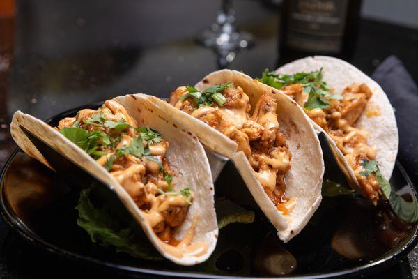 chicken tacos barbecue-glazed chicken, coleslaw, chipotle aioli drizzle, cilantro