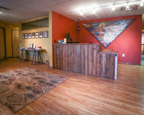 Front Desk / Reception with the "Atlas Angel" on the wall.