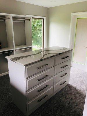 Painted white closet cabinetry