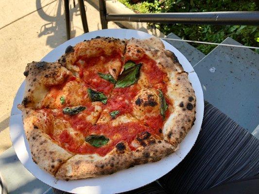 Delicious food truck pizza made vegan (without cheese).