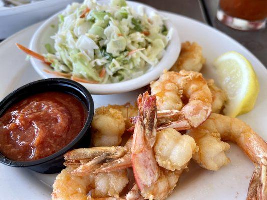 Lightly breaded Fried shrimp platter and a side of Cole slaw