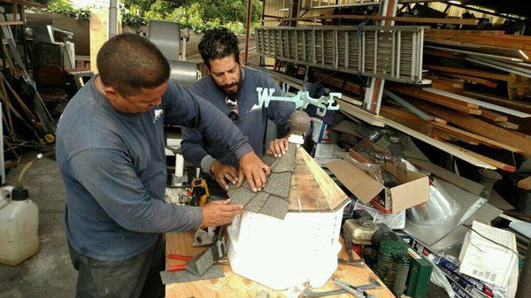 The guys from K Reed Roofing working on the Coppola.