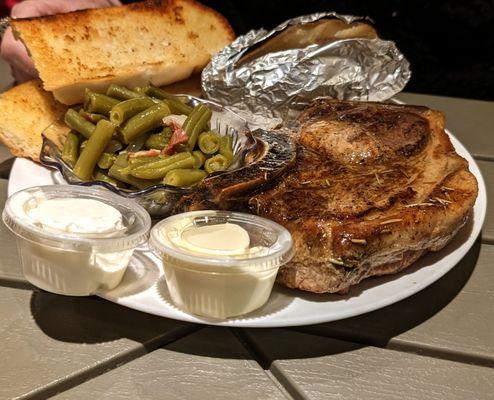 Pork Chop, Baked potatoes and beans. $11.