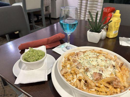 Cheesy fries with chicken (custom ordered), side of house-made guacamole, moscato