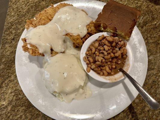 Chicken fried chicken, mash potatoes and black eyed peas served by Briana.