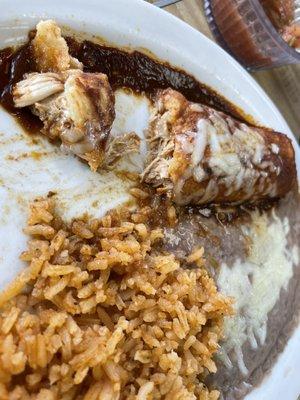 Senior lunch: chicken enchilada and rice and beans. Best chicken enchilada I've ever had.