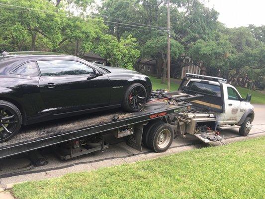 The car was safely winched into the truck with no damage to the low front spoiler