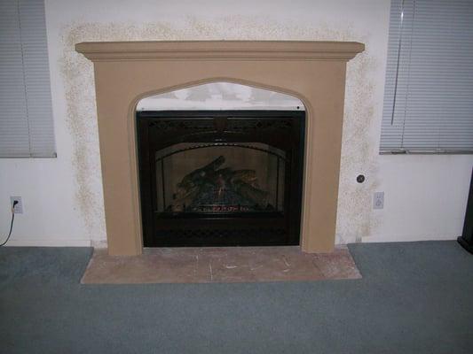 Removed Existing Fireplace. Replaced with Electronic Gas and Custom Surround