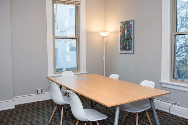 Conference room with whiteboard and TV