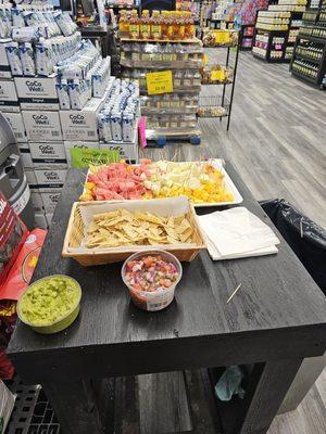 Fresh samples of fruit, guacamole and pico de gallo