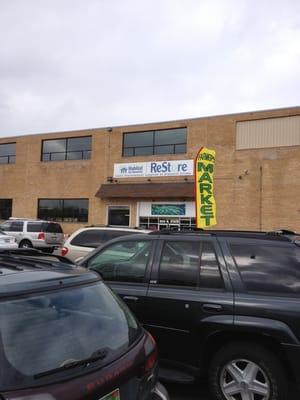 You can see the market sign in the lot separate from the Restore sign.