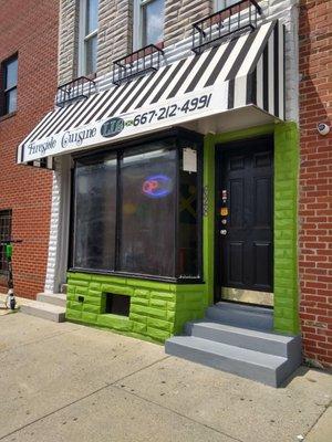 The outside of Fireside Cuisine with a new awning.