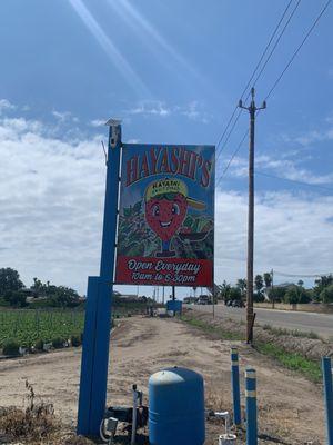 Business sign and hours.