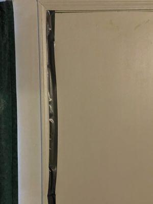 Duct tape on the inside of the door.