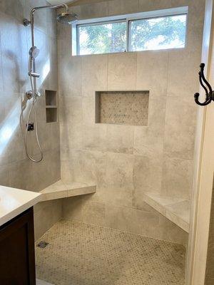 12x24 tile shower with 2 corner seats and 2 niches. Love it