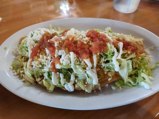 Quesadilla de Piccadillo  Seasoned ground beef, potatoes, carrots, onion, topped with lettuce, crema, queso fresco, and salsa.