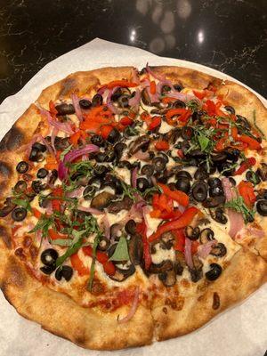 The Verdura 12" pizza. With mushrooms, olives, bell peppers, onion, basil.