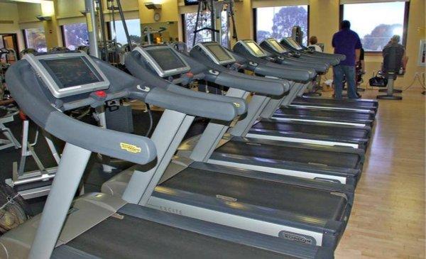 Treadmills and elliptical machines feature personalized televisions.