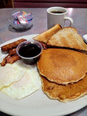 Breakfast: pancakes eggs, sausage and bacon.