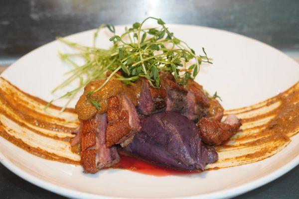 Crispy skin Duck breast with a purple mash and mole sauce