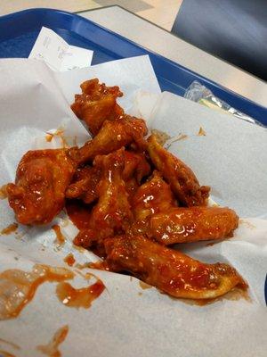 XXX-Hot wings, nice and crispy on the outside, and swimming in sauce at the bottom.