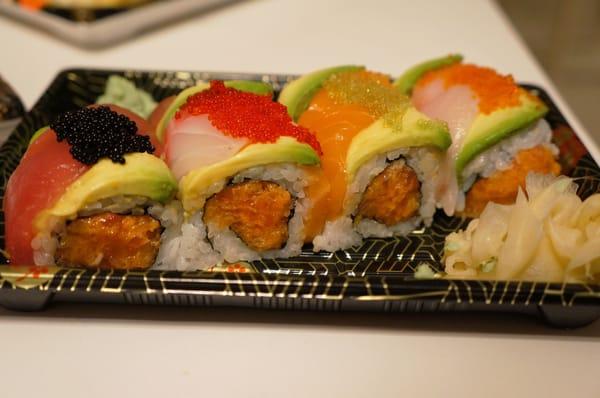 NEW WINDSOR ROLL: Spicy tuna inside, topped w/ salmon, tuna, white tuna, white fish, avocado & tobiko