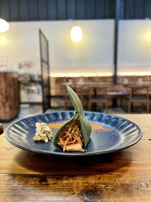 Gobo over salmon in banana leaf