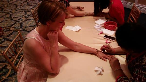 Indian artisans doing henna tattoos for the ladies,  who loved them!