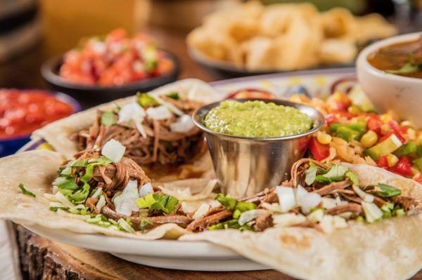 Brisket Tacos
Two slow smoked brisket tacos with flour tortillas served with spicy Mexican cole slaw, avocado and pico de gallo.