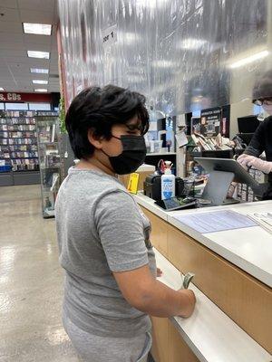 My LOVE paying for his books. Cashier section.