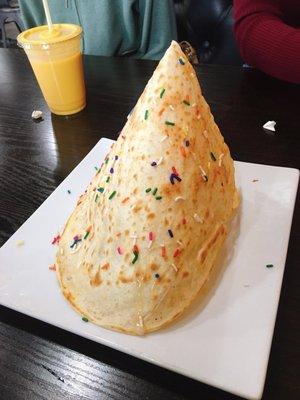 Tissue prata (paper thin, crispy prata, topped with condensed milk and sprinkles)