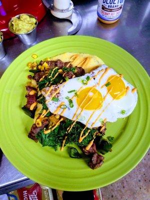 Brunch special  Jalapeño grits with flank steak kale and sunny side eggs