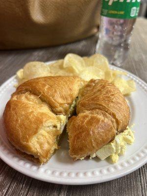 Egg salad and percent with chips and sprite